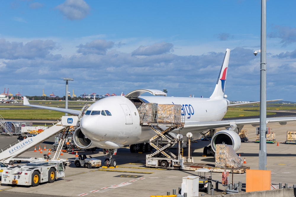 Cargo aircraft being loaded on the airport apron