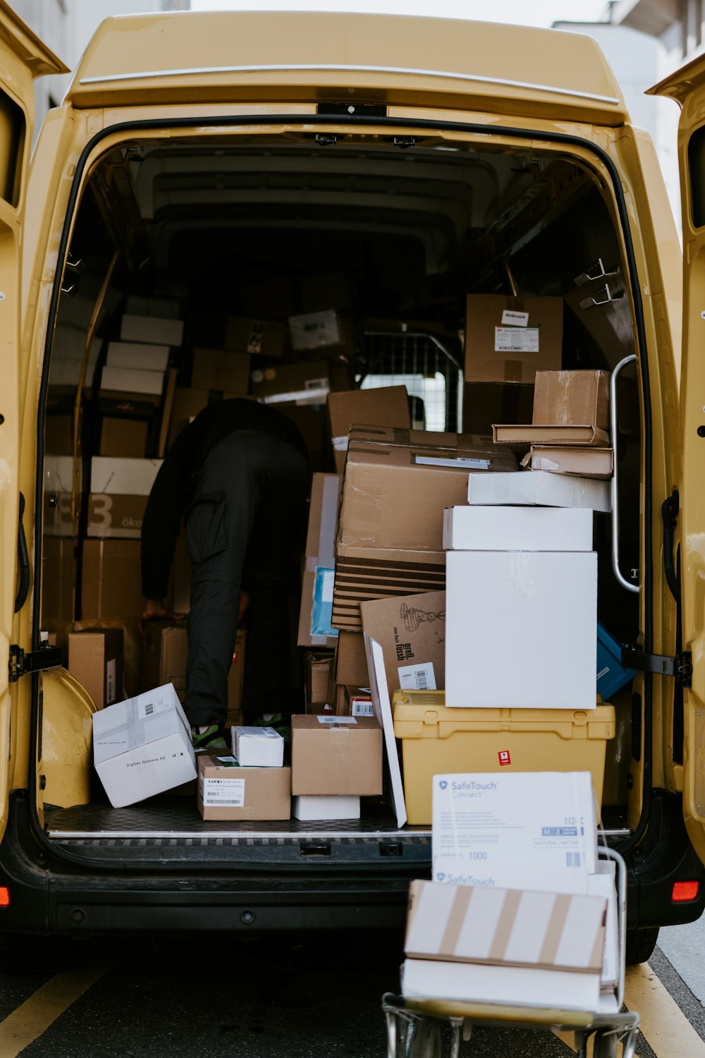Cardboard parcels stacked on warehouse shelving